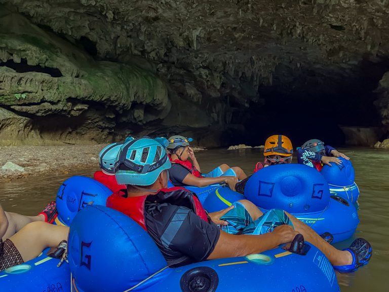 Guests cave tubing on the river